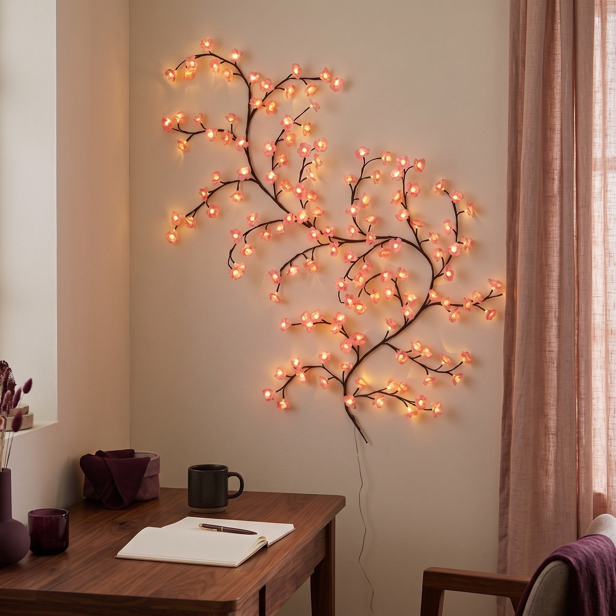 Pink blossom vine in a cosy study at night